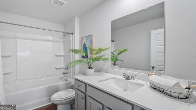 full bathroom featuring toilet, vanity, wood-type flooring, and shower / bath combination