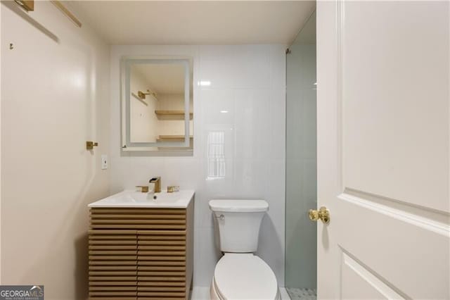 bathroom with toilet and vanity