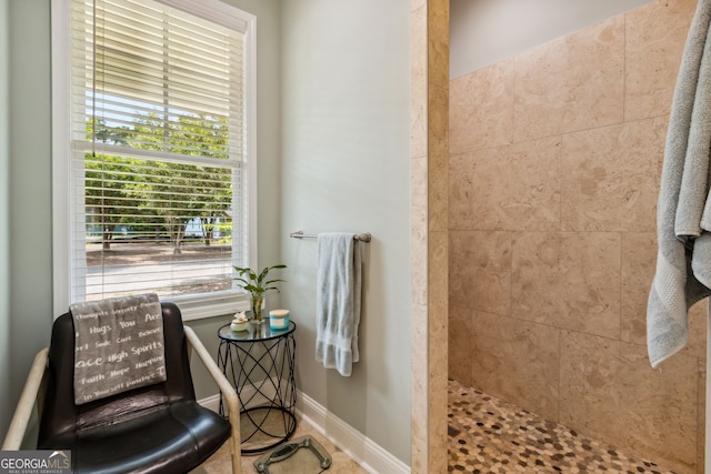 bathroom featuring a tile shower