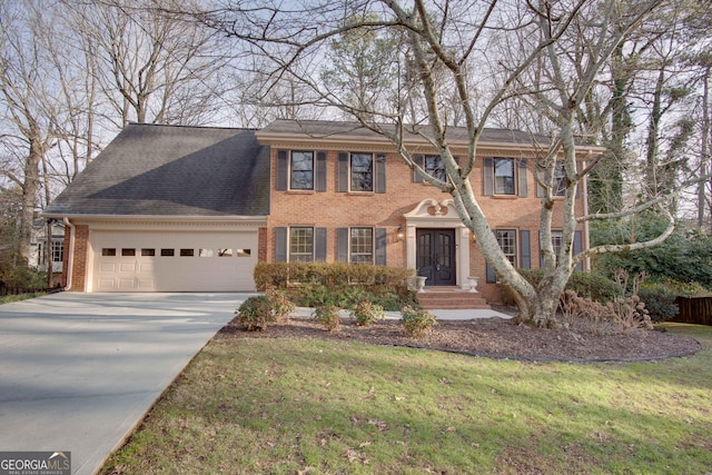 view of front of house featuring a garage and a front yard