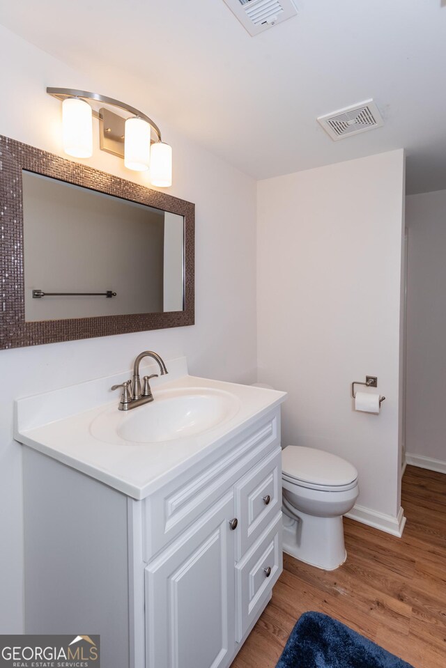 carpeted bedroom featuring a textured ceiling, ceiling fan, a closet, and ensuite bath