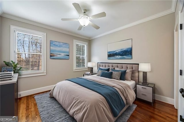 bedroom with crown molding, ceiling fan, and dark hardwood / wood-style flooring