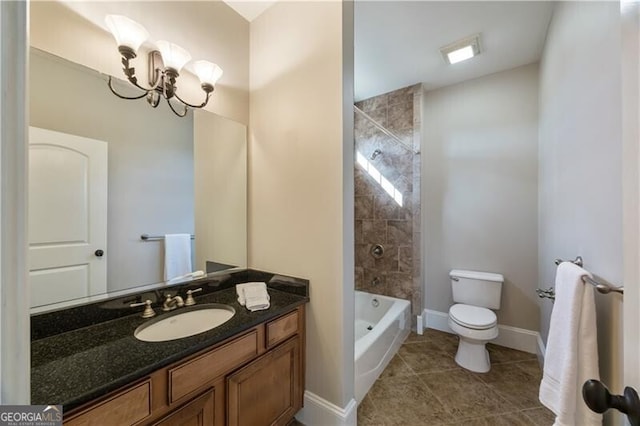 full bathroom featuring toilet, tiled shower / bath, vanity, a notable chandelier, and tile patterned flooring