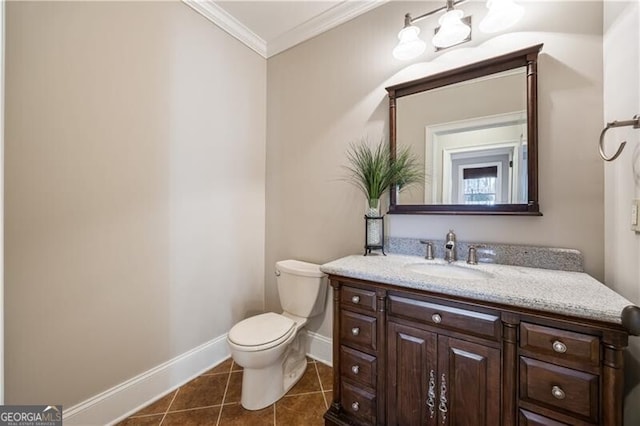 bathroom featuring ornamental molding, toilet, tile patterned flooring, and vanity