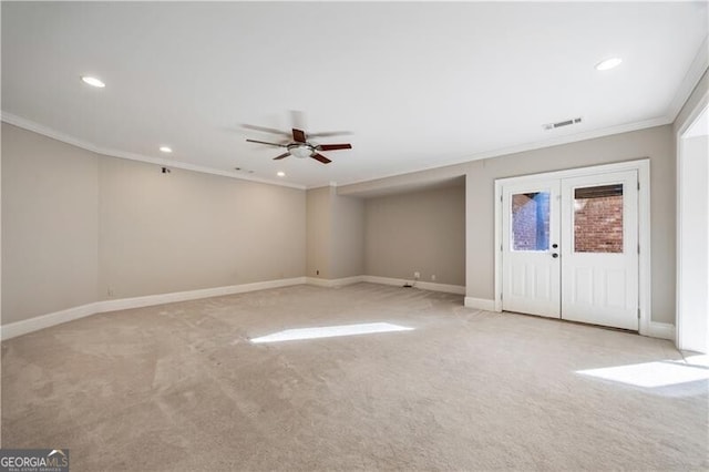 interior space featuring french doors, light colored carpet, and ornamental molding