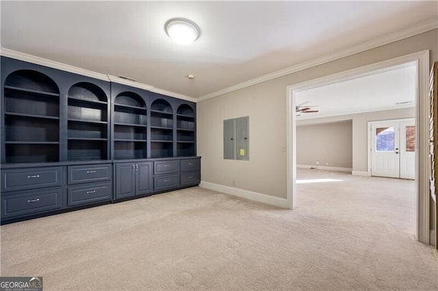 unfurnished living room with light colored carpet, ornamental molding, and electric panel