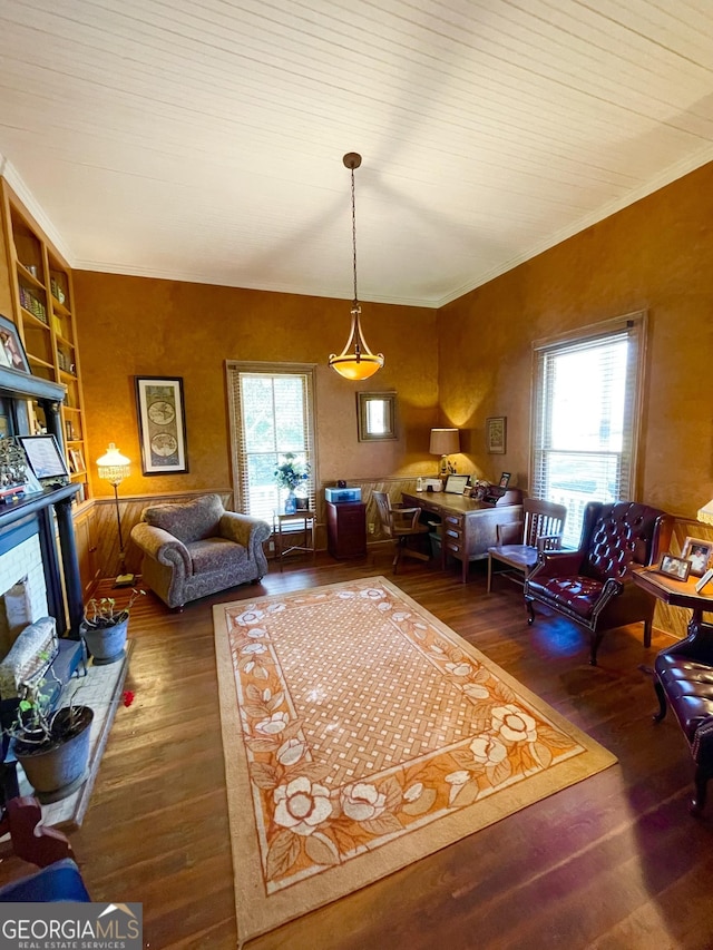 interior space with a healthy amount of sunlight, built in features, and dark hardwood / wood-style flooring