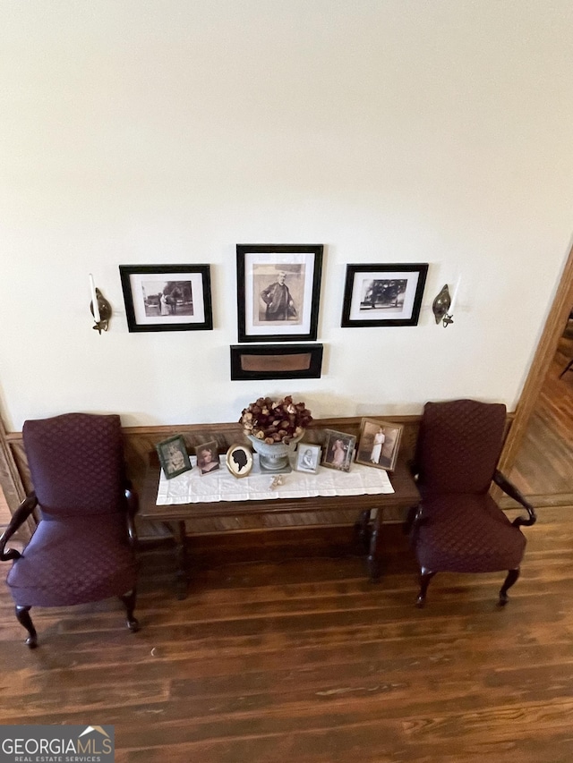 sitting room with dark hardwood / wood-style flooring