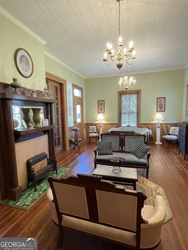 living room with an inviting chandelier, ornamental molding, wood ceiling, and hardwood / wood-style floors