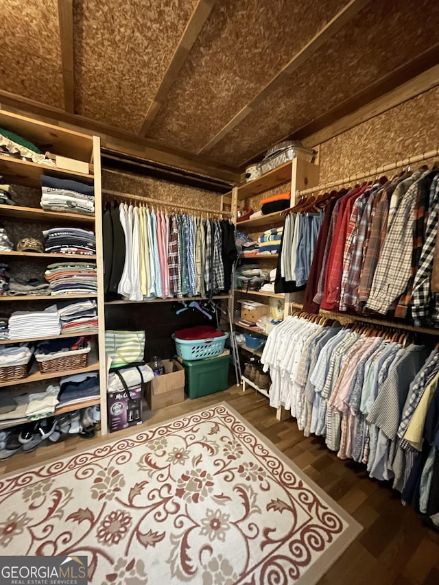 spacious closet featuring hardwood / wood-style flooring