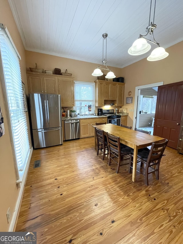 dining area with light hardwood / wood-style floors, wooden ceiling, sink, and ornamental molding