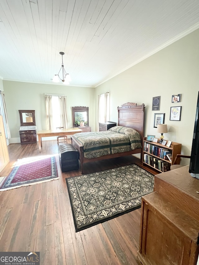 bedroom featuring ornamental molding, wood ceiling, a chandelier, and hardwood / wood-style floors