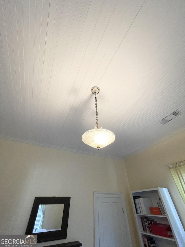 details with wood ceiling and crown molding