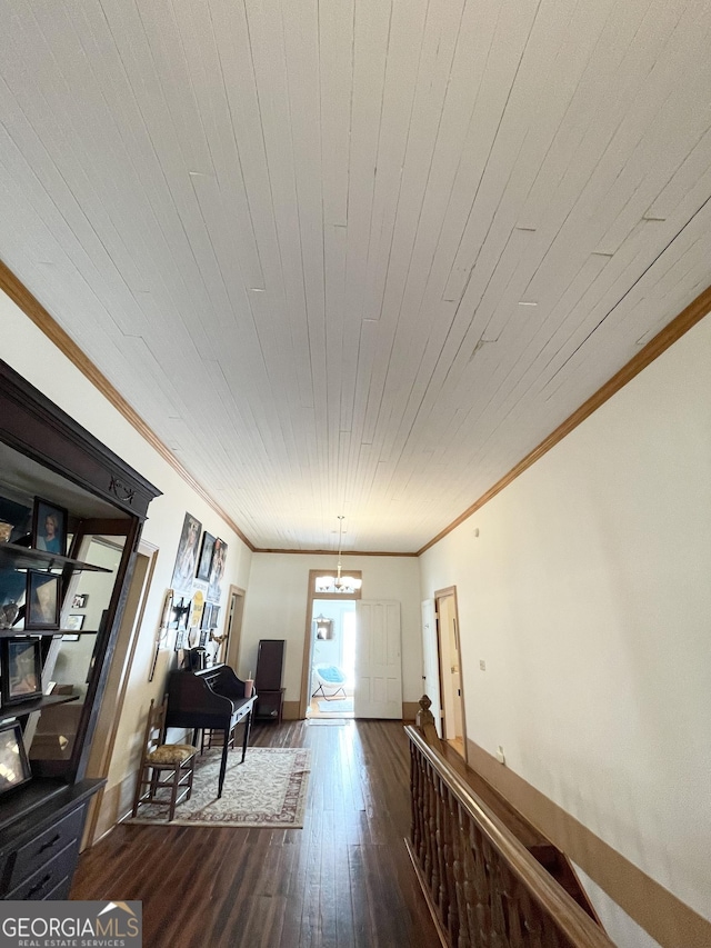 hallway featuring wooden ceiling, ornamental molding, and dark hardwood / wood-style floors