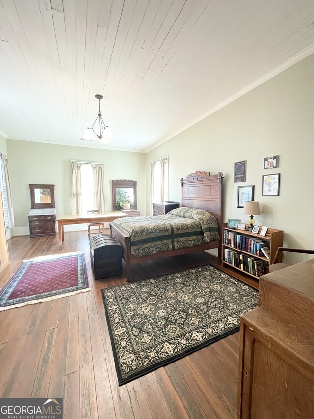 bedroom with an inviting chandelier, wood ceiling, crown molding, and hardwood / wood-style flooring