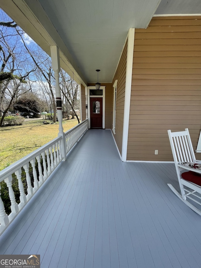 wooden terrace with covered porch