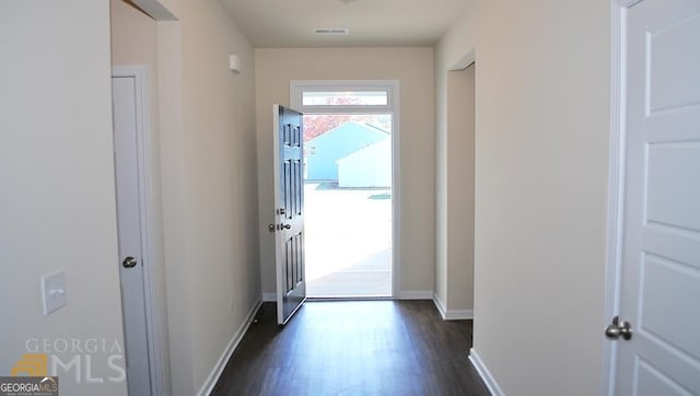 doorway to outside featuring dark hardwood / wood-style floors