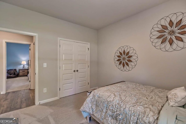 bedroom with a closet and carpet