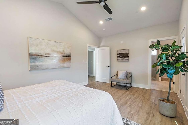 bedroom featuring ceiling fan, light wood-type flooring, and high vaulted ceiling