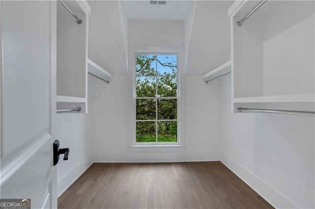 walk in closet featuring hardwood / wood-style floors