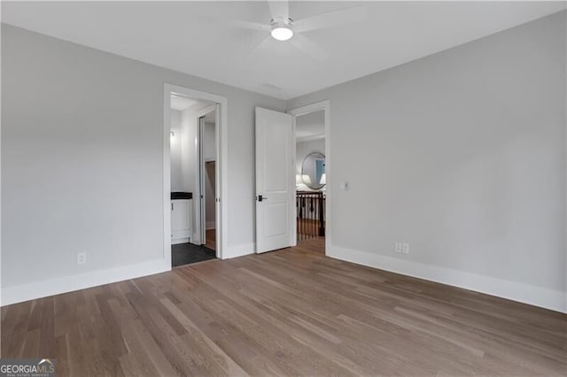 unfurnished bedroom featuring ceiling fan and wood-type flooring