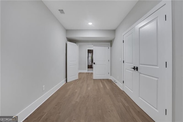 corridor featuring light hardwood / wood-style floors