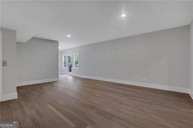 unfurnished room featuring dark hardwood / wood-style flooring and french doors