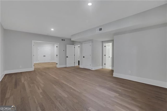 unfurnished living room featuring light hardwood / wood-style flooring