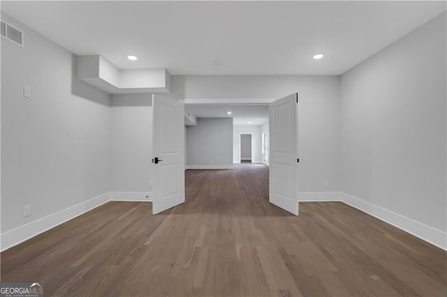 unfurnished room featuring hardwood / wood-style flooring