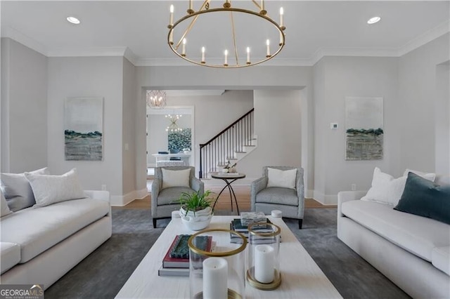 living room with ornamental molding and a chandelier