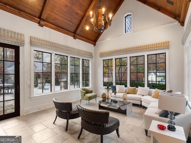 sunroom with wooden ceiling, a wealth of natural light, and a notable chandelier