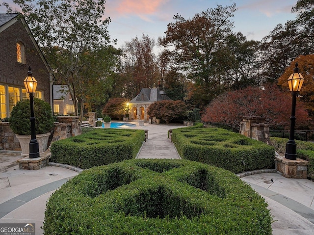 surrounding community with a patio area and a pool