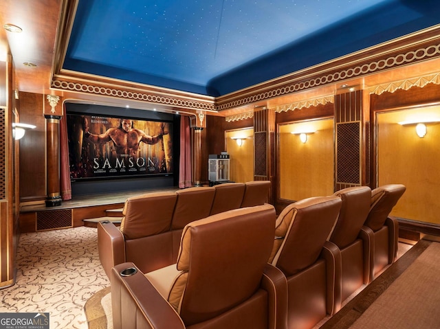 cinema room featuring light carpet