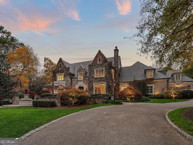 tudor home with a yard