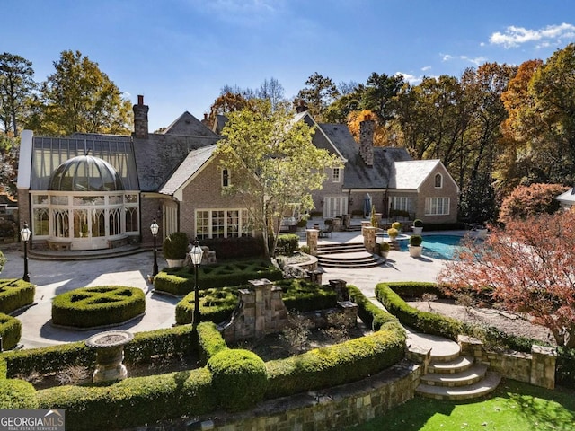 rear view of property featuring a patio area