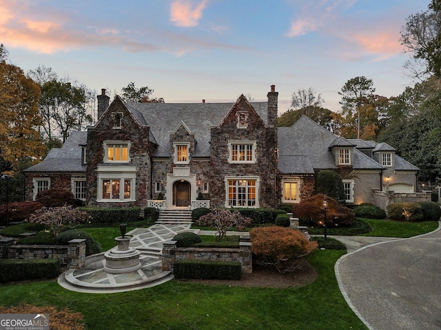 view of front of home with a yard