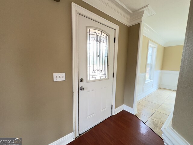 unfurnished living room featuring ceiling fan, dark wood-type flooring, and crown molding