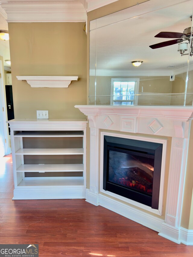 kitchen featuring an inviting chandelier, white cabinetry, black fridge, stove, and pendant lighting