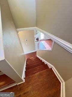 stairway with wood-type flooring