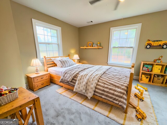 bedroom featuring ceiling fan and carpet floors