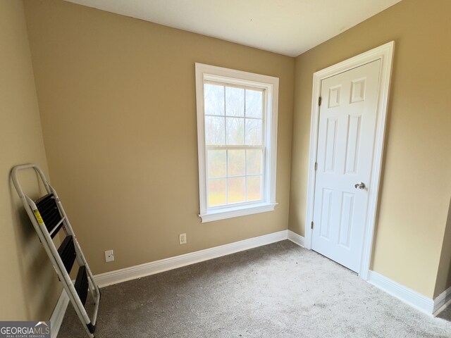 unfurnished bedroom with ceiling fan and carpet flooring