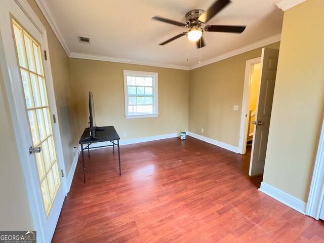 bathroom featuring toilet, vanity, and crown molding