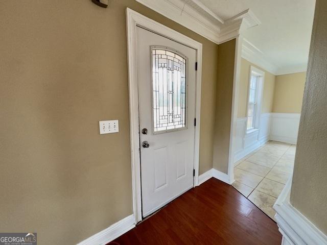 interior space featuring ceiling fan, crown molding, and hardwood / wood-style flooring