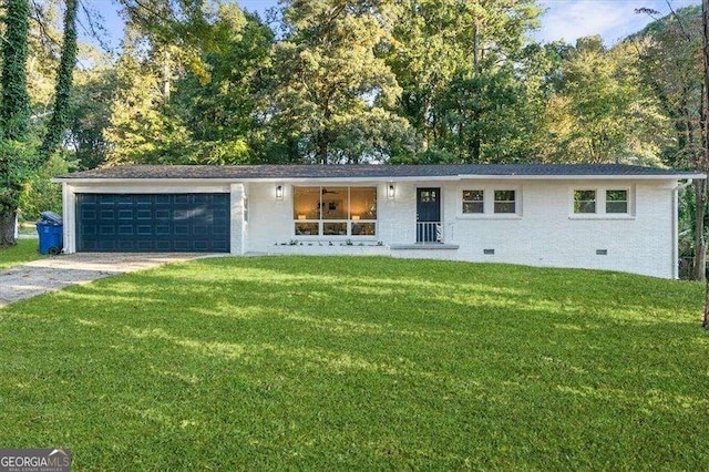 ranch-style home featuring a garage and a front lawn