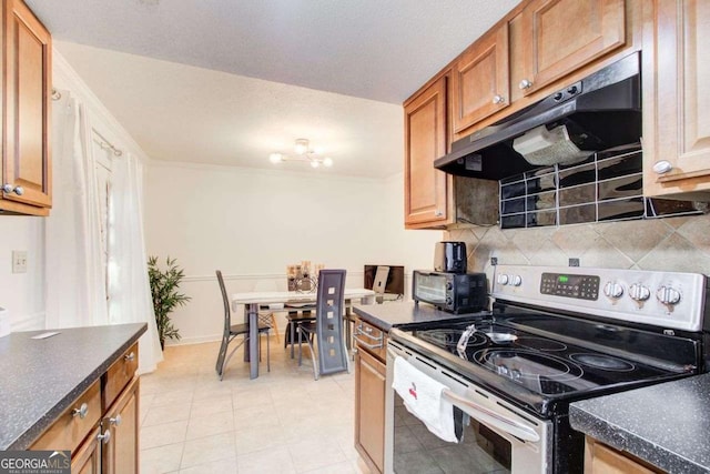 kitchen with light tile patterned floors, stainless steel range with electric stovetop, and tasteful backsplash