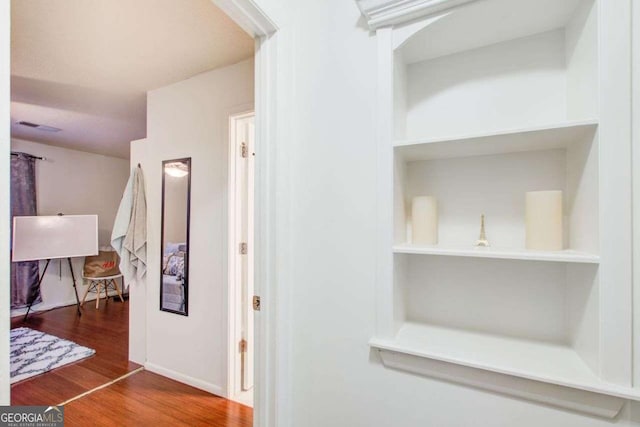 hall featuring wood-type flooring