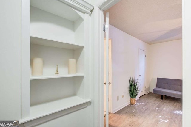 corridor featuring hardwood / wood-style flooring