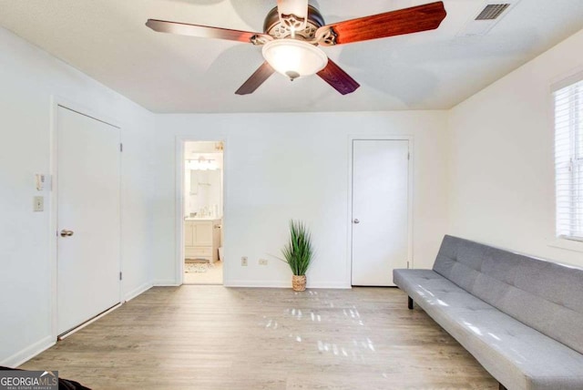 unfurnished room with ceiling fan and light hardwood / wood-style floors