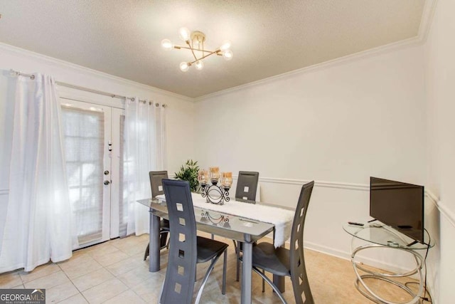 dining area featuring a notable chandelier, crown molding, a textured ceiling, light tile patterned floors, and french doors