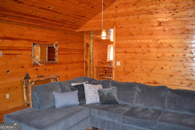 living room with vaulted ceiling, wooden walls, and wood ceiling